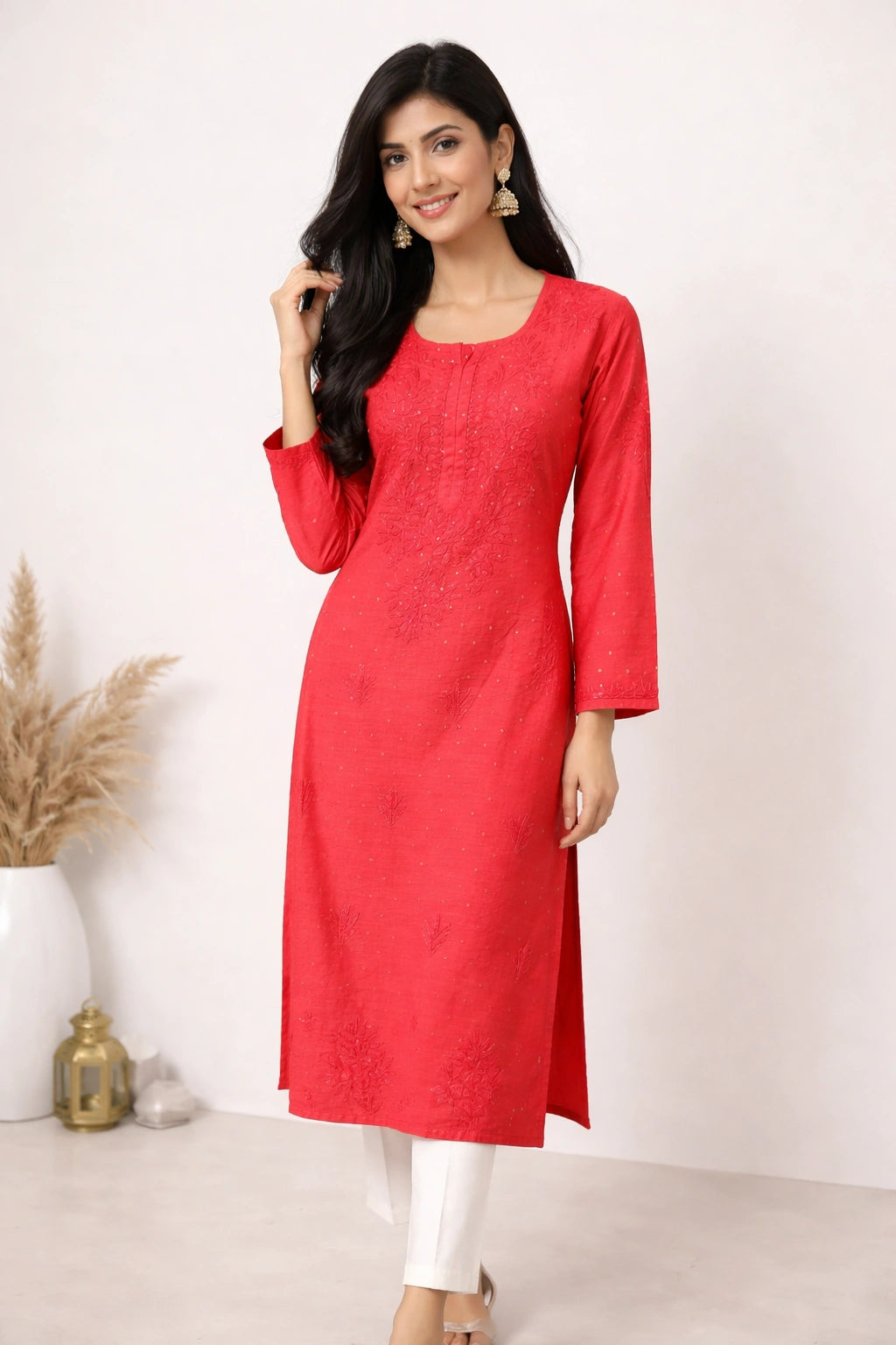 lucknowi chikankari Woman wearing a red kurta with white pants against a white background