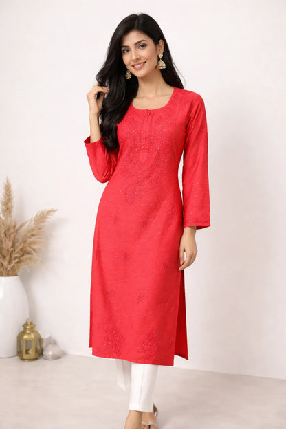 lucknowi chikankari Woman wearing a red kurta with white pants against a white background