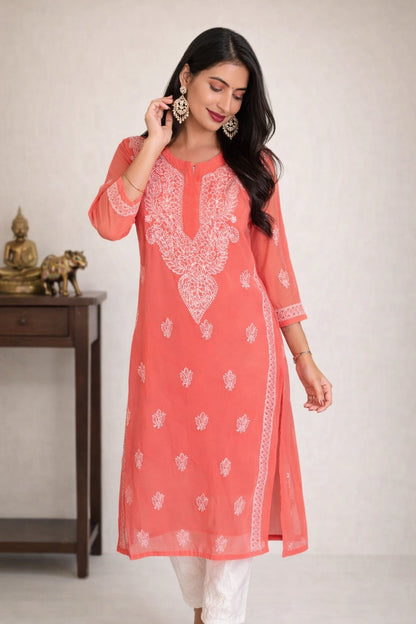 lucknowi chikankari Woman wearing a red kurta with white pants against a white background