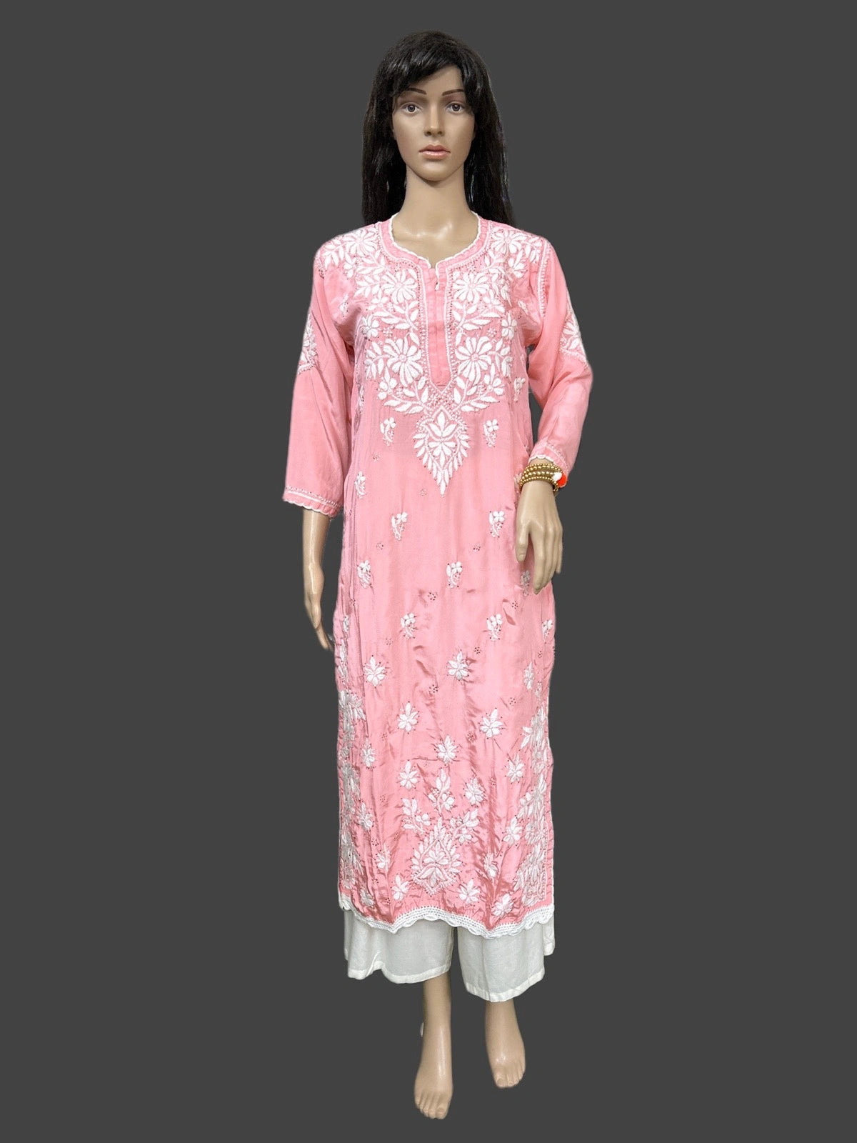 lucknowi chikankari Mannequin wearing a pink floral dress on a gray background