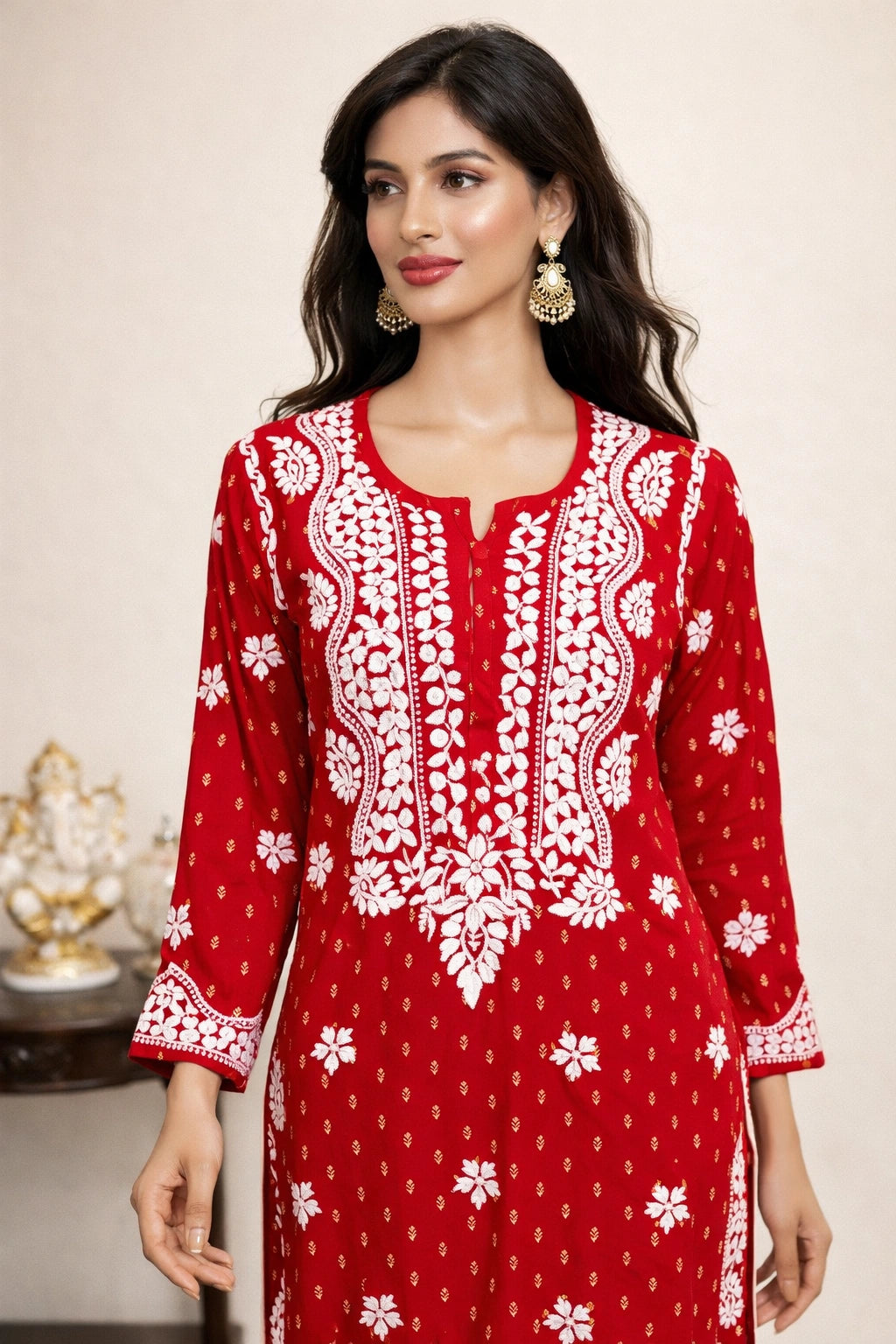 lucknowi chikankari Woman wearing a red and white patterned dress against a neutral background