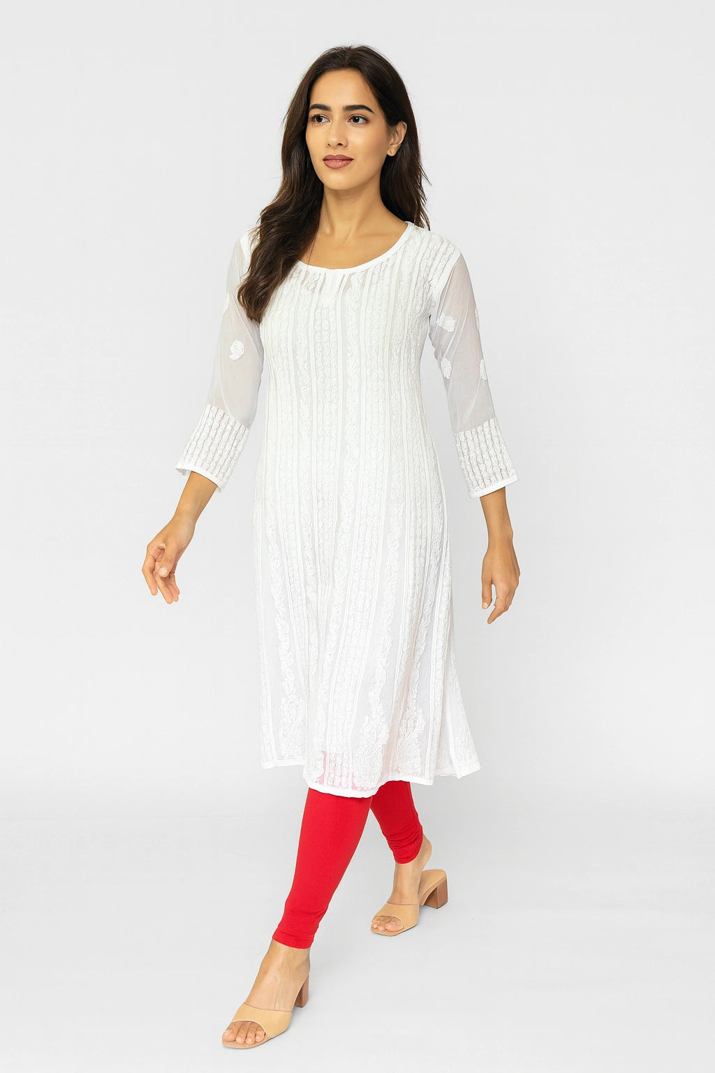 lucknowi chikankari Woman wearing a white dress with sheer sleeves on a white background