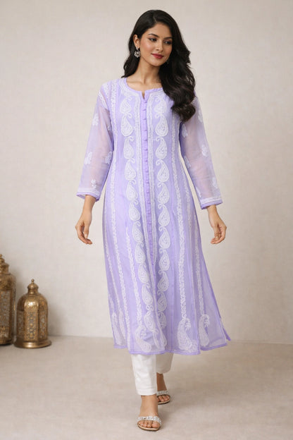 Woman wearing a light purple embroidered kurta with white pants against a neutral background