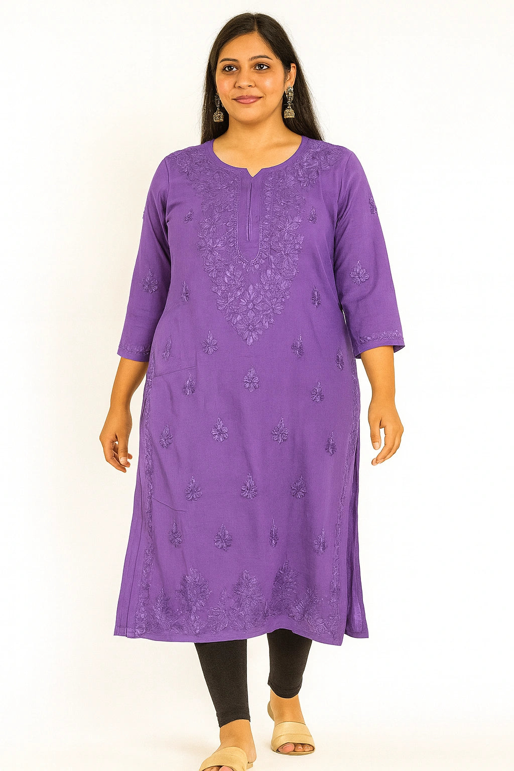 Woman wearing a purple embroidered kurta against a white background
