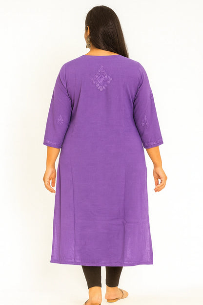 Woman wearing a lucknowi chikankari purple kurta with intricate designs on a white background