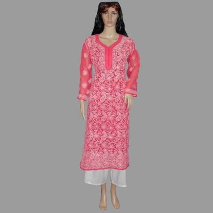 Mannequin wearing a pink embroidered dress on a gray background