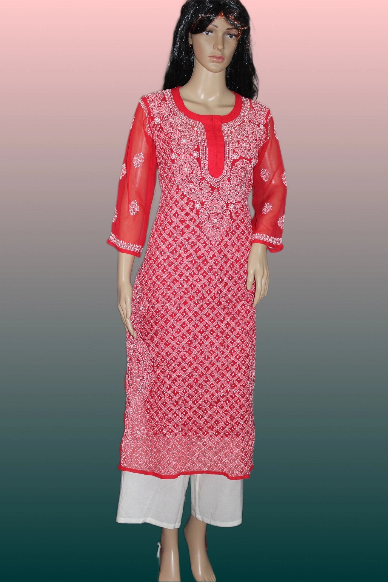 Red embroidered kurta with white pants on a gradient background
