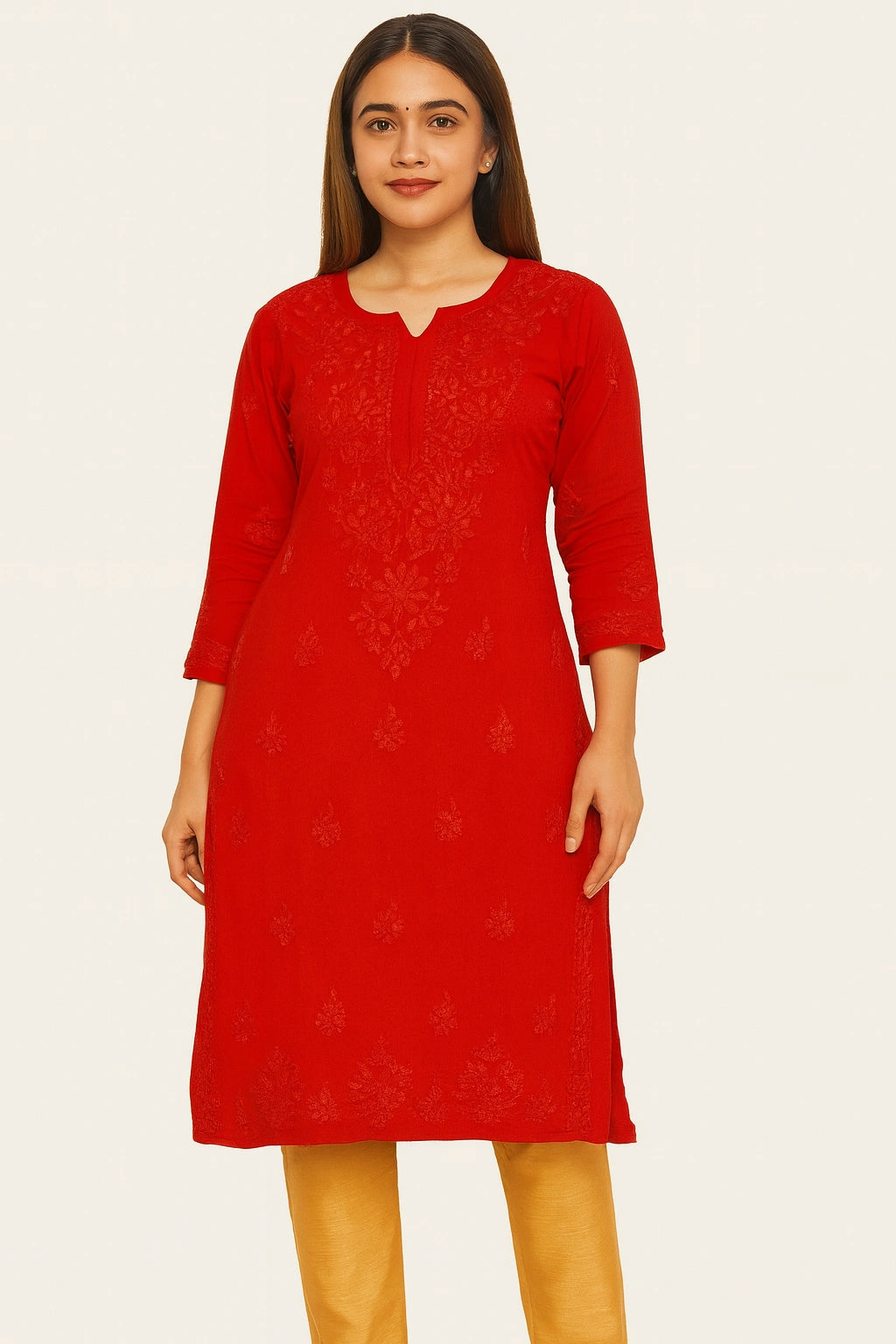 Woman wearing a lucknowi chikankari red dress with floral patterns on a white background