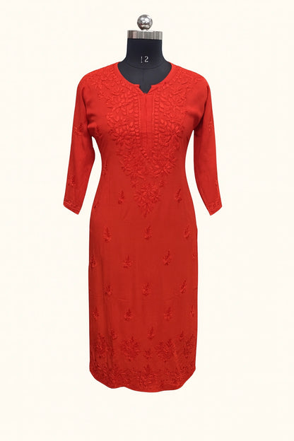 lucknowi chikankari Red dress on a mannequin against a white background
