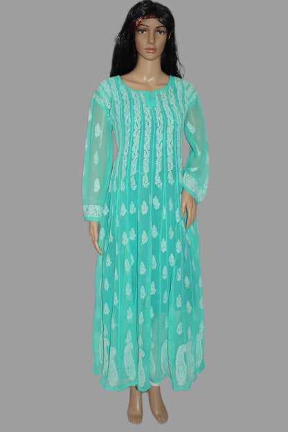 Mannequin wearing a turquoise dress with white patterns on a gray background
