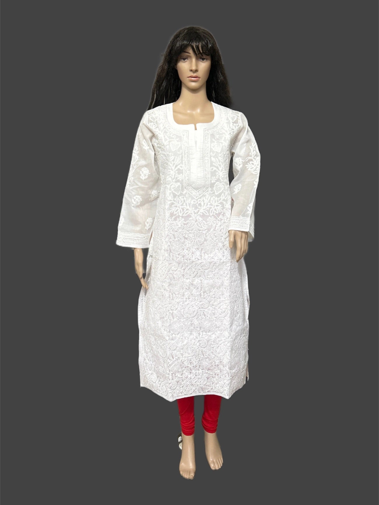 White embroidered kurta on a mannequin against a gray background