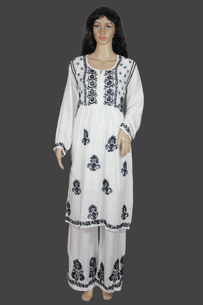 White outfit with black floral patterns on a gray background