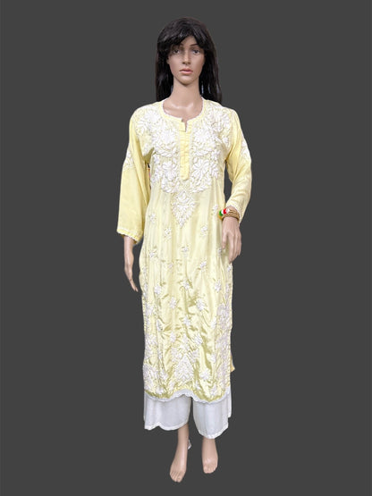 Mannequin wearing a light yellow embroidered kurta with white pants on a dark background