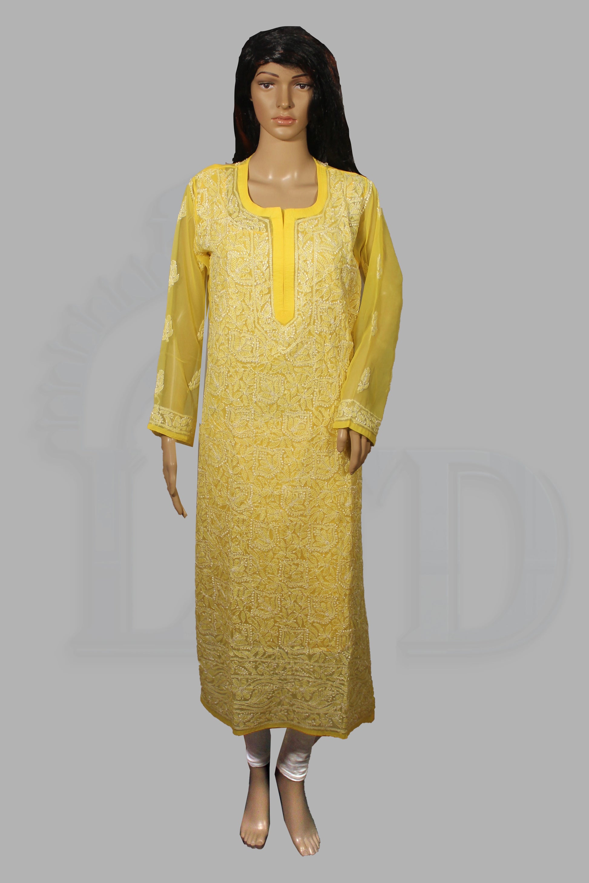 Yellow dress on a mannequin against a gray background