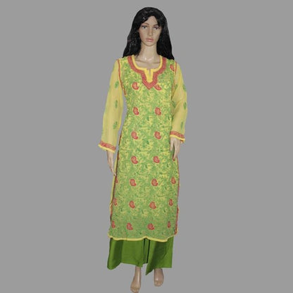 Green and chikan kadhai yellow traditional outfit on a mannequin against a gray background