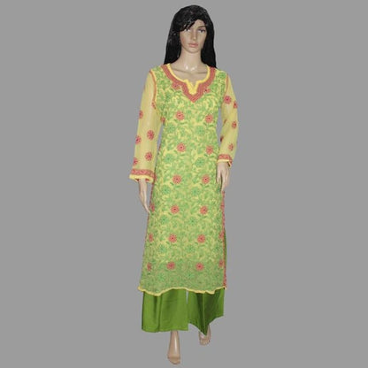 Green and yellow embroidered dress on a mannequin against a gray background