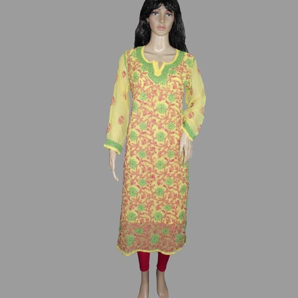 Mannequin wearing a floral dress with yellow and green accents on a gray background