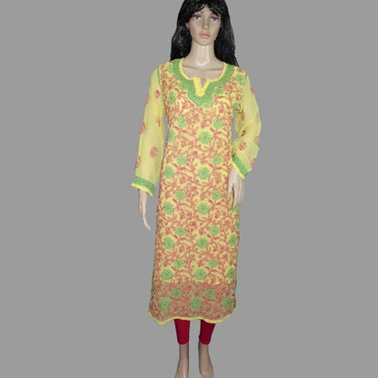 Mannequin wearing a floral dress with yellow and green accents on a gray background