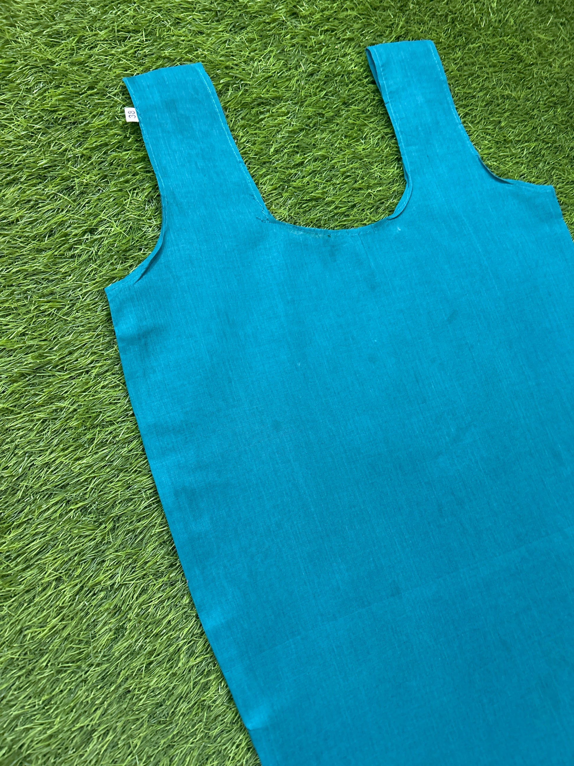 Slip laid flat on green grass.
