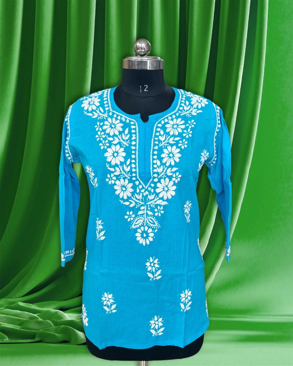 Mannequin wearing a lucknowi chikankari blue top.