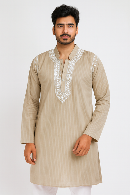 Man wearing a beige kurta with white embroidery on a white background