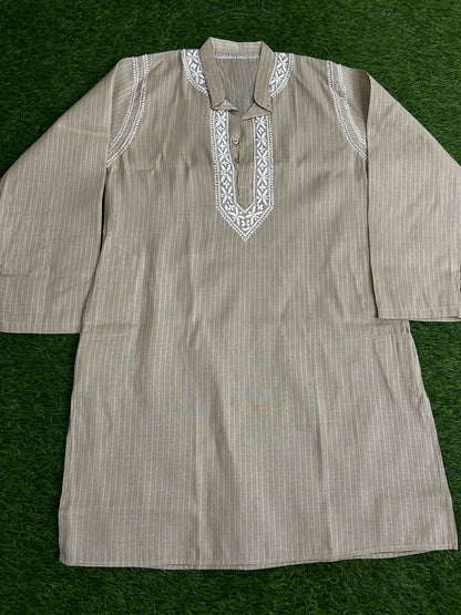Striped kurta with embroidered details on a green background