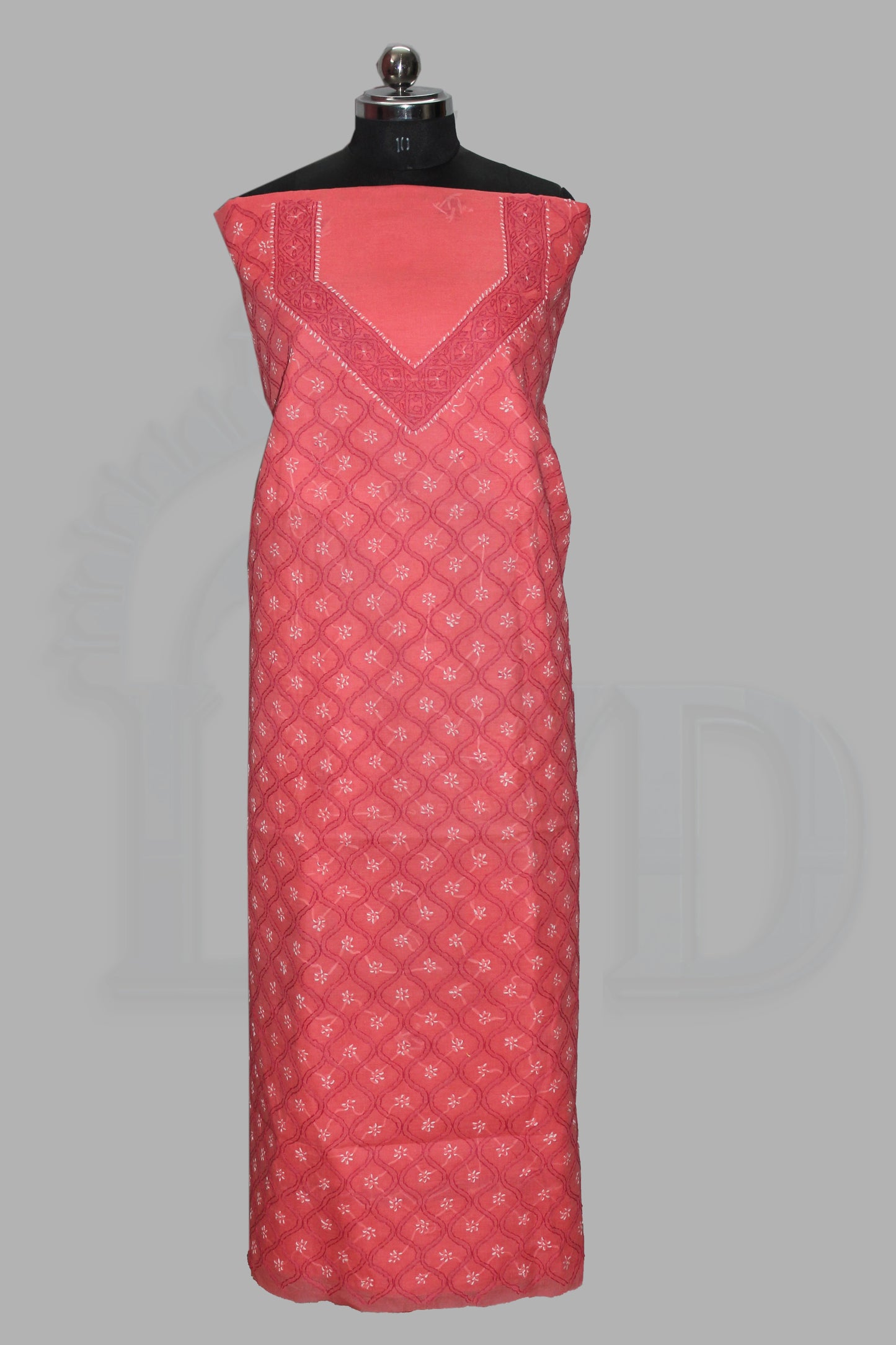 lucknowi chikankari Red patterned dress on a mannequin against a gray background