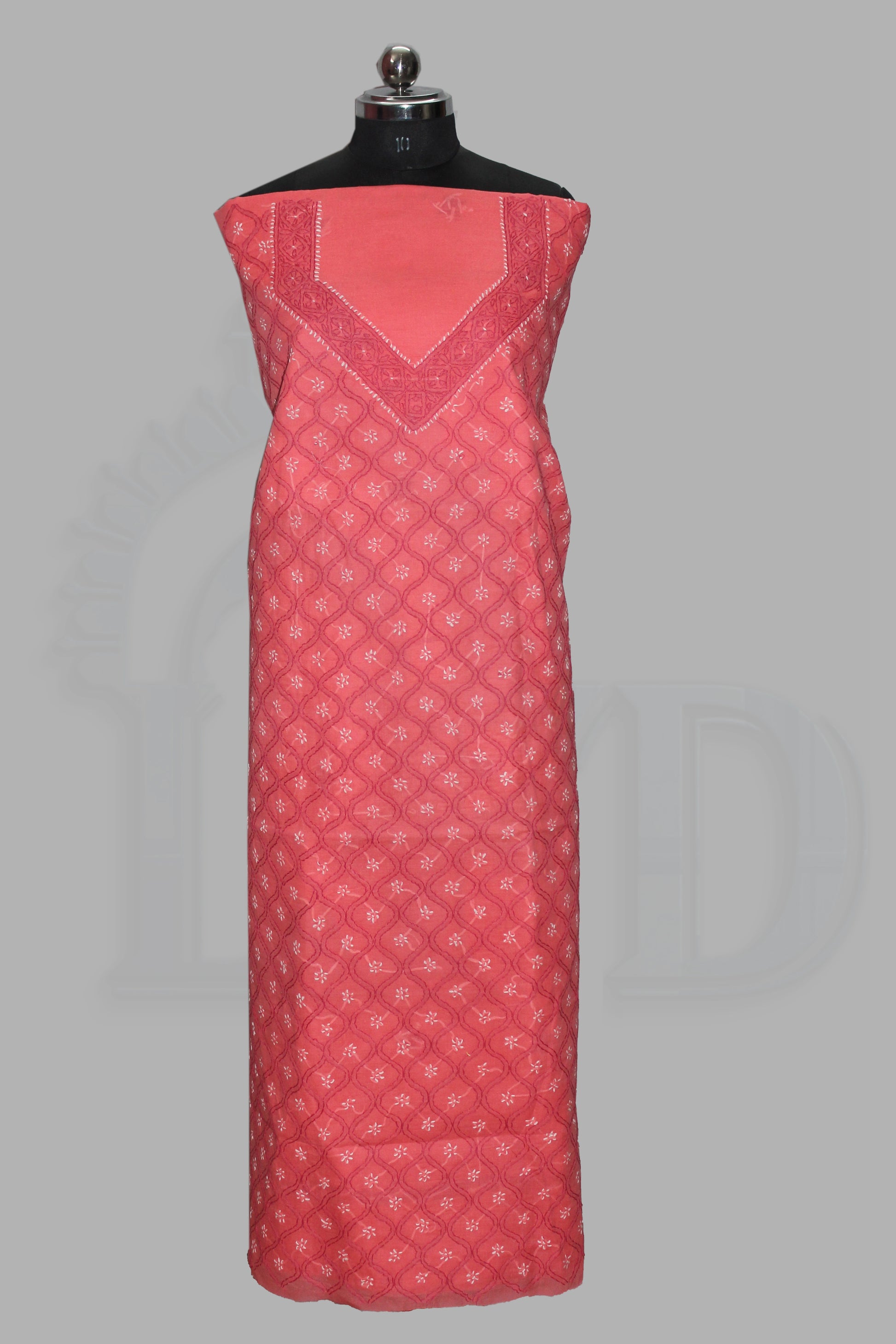 lucknowi chikankari Red patterned dress on a mannequin against a gray background