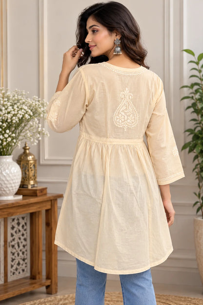 lucknowi chikankari Woman wearing a floral dress with a white background