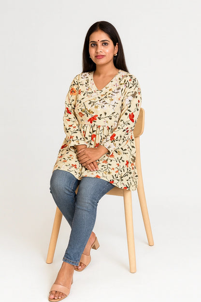 lucknowi chikankari Woman wearing a yellow floral dress sitting on a wooden chair against a white background