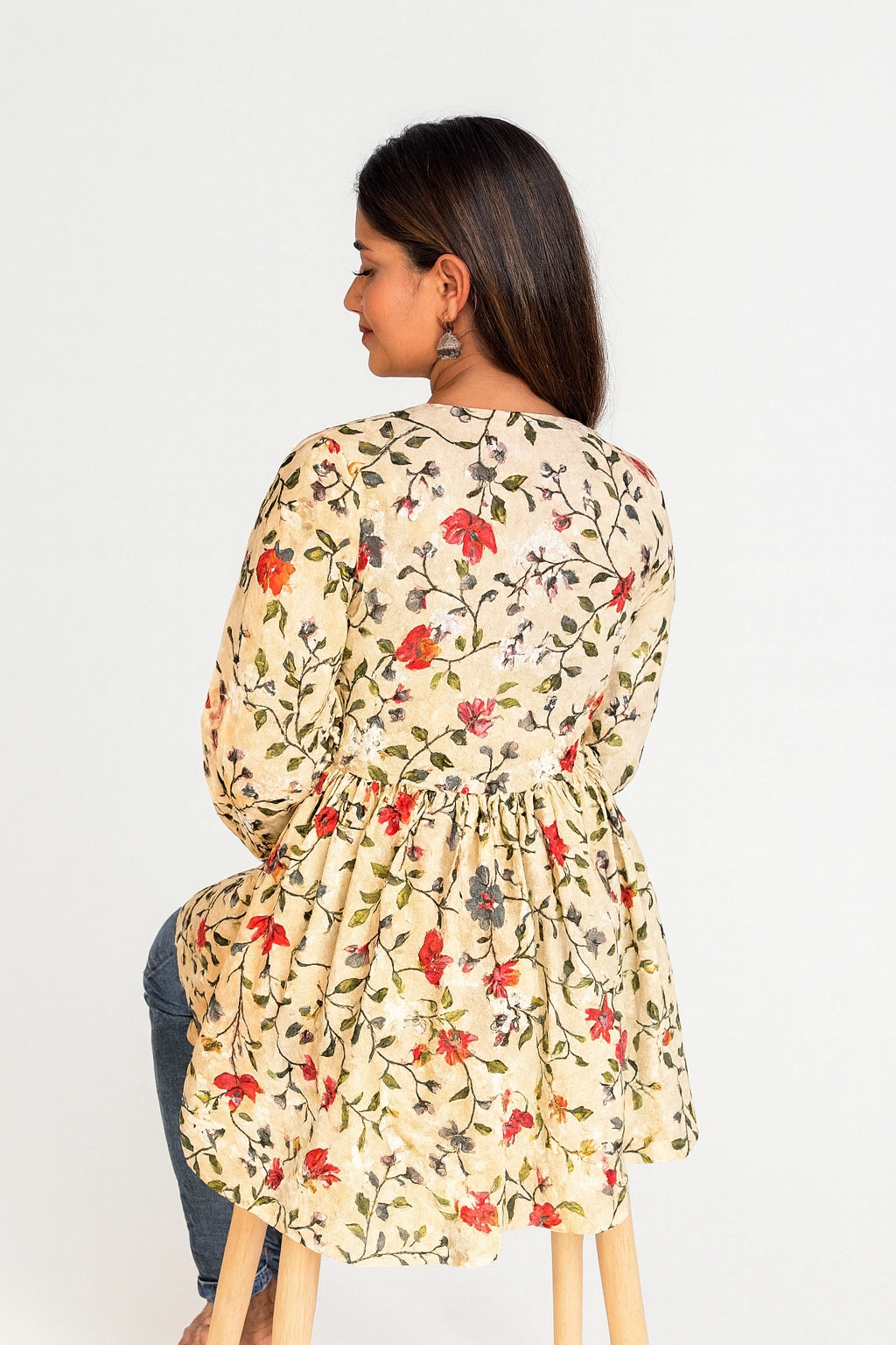 lucknowi chikankari Woman wearing a floral dress with a white background