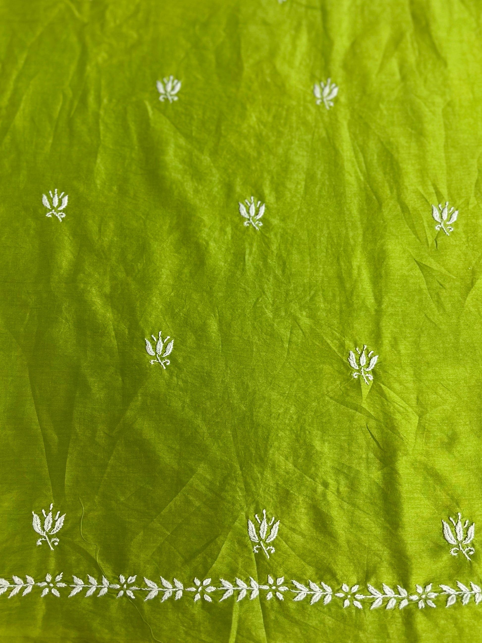 Lucknowi chikankari Green fabric with white floral patterns