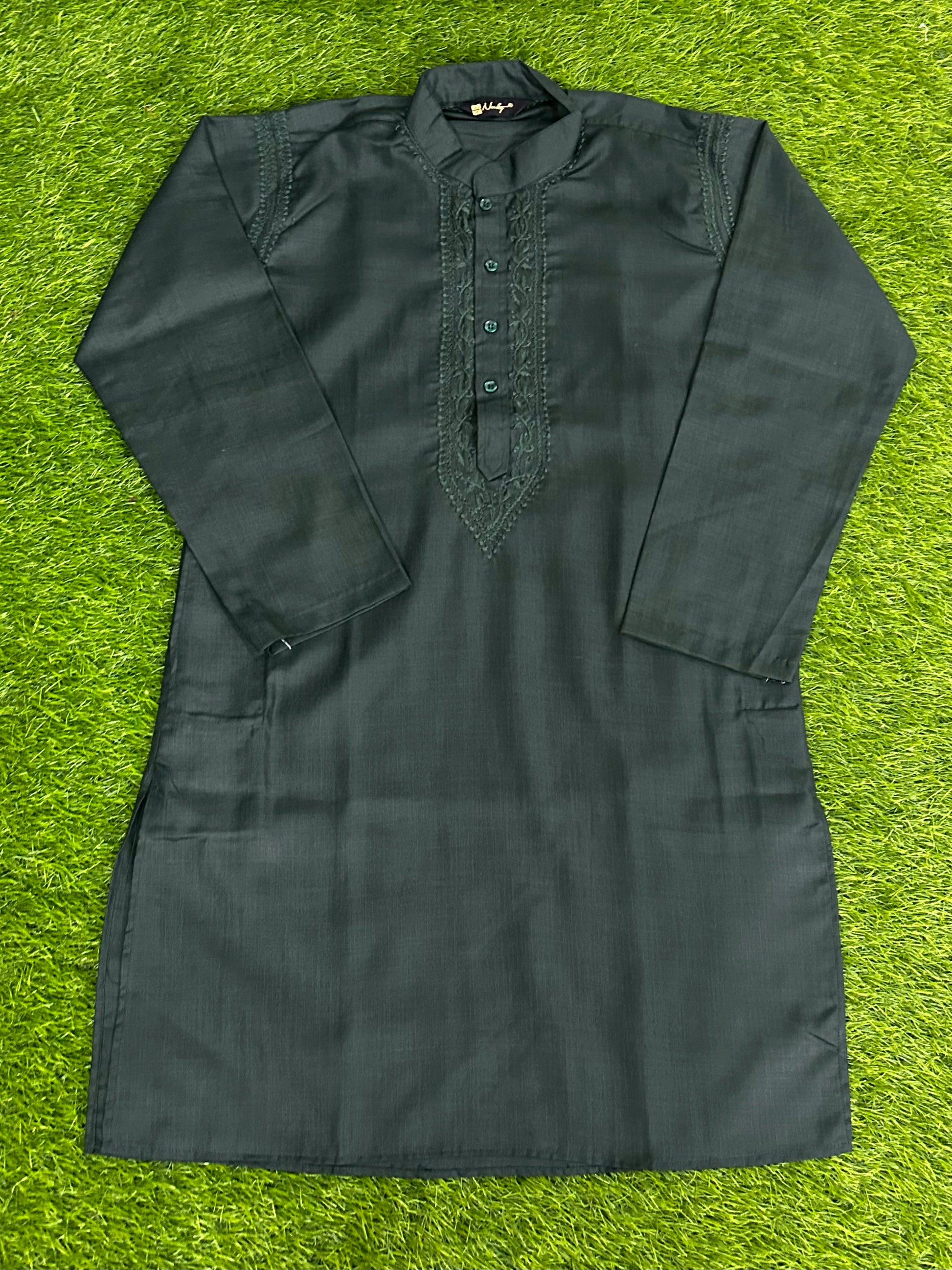 lucknowi chikankari Dark green kurta shirt on a grassy background