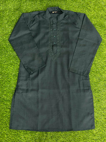 lucknowi chikankari Dark green kurta shirt on a grassy background