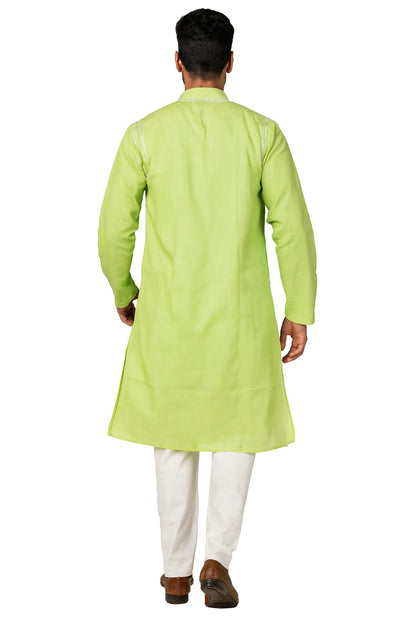 Man wearing a lucknowi light green kurta with white pants on a white background