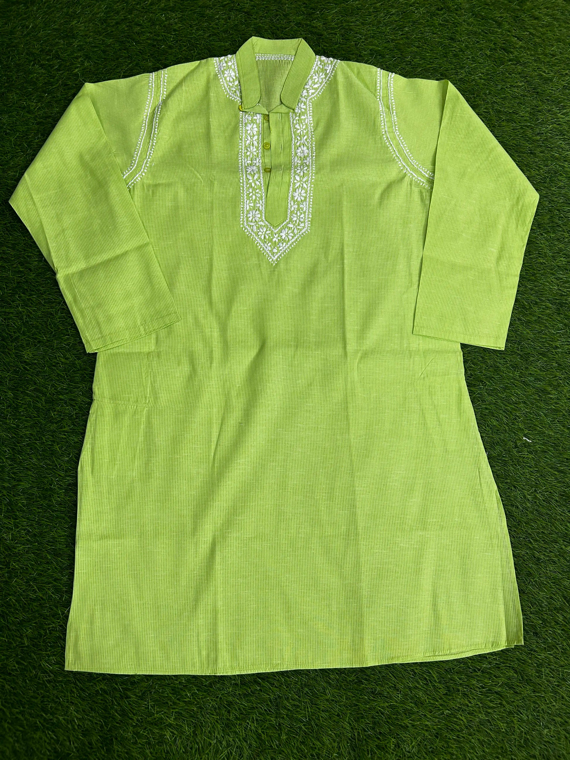 Green kurta with white embroidery on a green background
