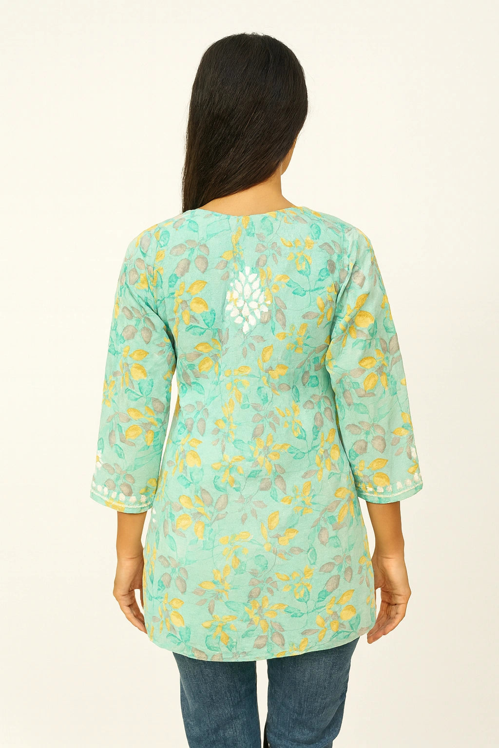 lucknowi cikankari Woman wearing a light blue floral patterned top on a white background
