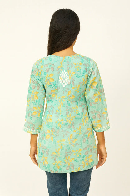 lucknowi cikankari Woman wearing a light blue floral patterned top on a white background