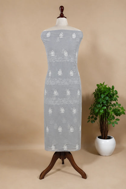 Lucknowi Chikankari Gray dress with white patterns on a mannequin against a beige background
