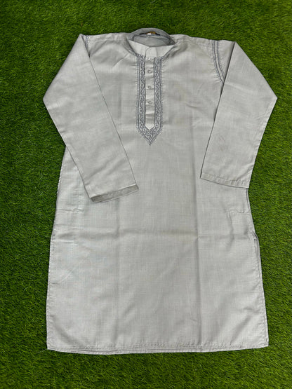 Light gray kurta with embroidery on a green background
