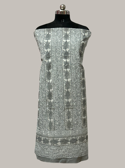 lucknowi chikankari Fabric with intricate patterns on a mannequin against a plain background