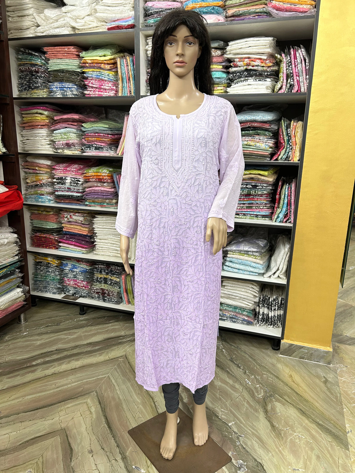 Mannequin wearing a lucknowi chikankari lavender-colored kurta