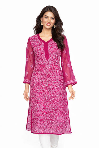 lucknowi chikankari Woman wearing a Magenta traditional outfit with orange floral patterns against 