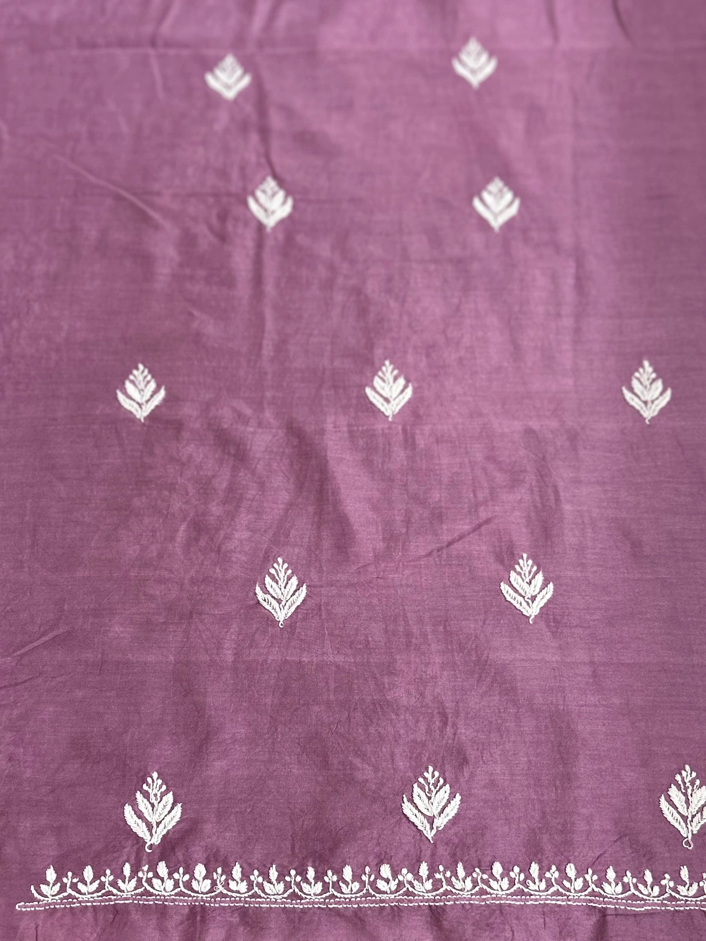Lucknowi Chikankari Purple fabric with white floral patterns