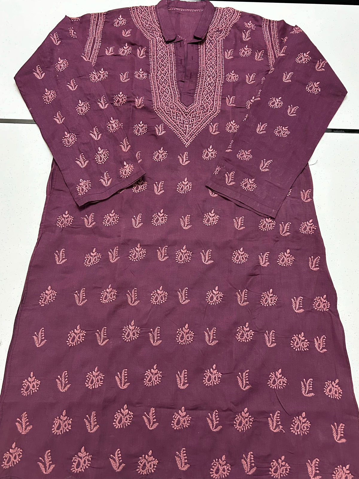 Mauve kurta with embroidery on a white background