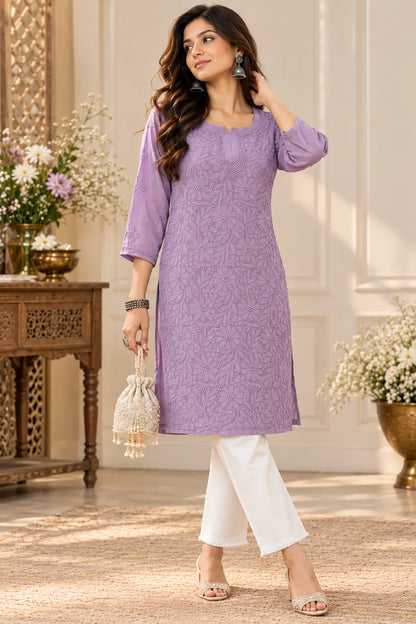 Woman wearing a lucknowi chikankari mauve-colored kurta with white floral patterns