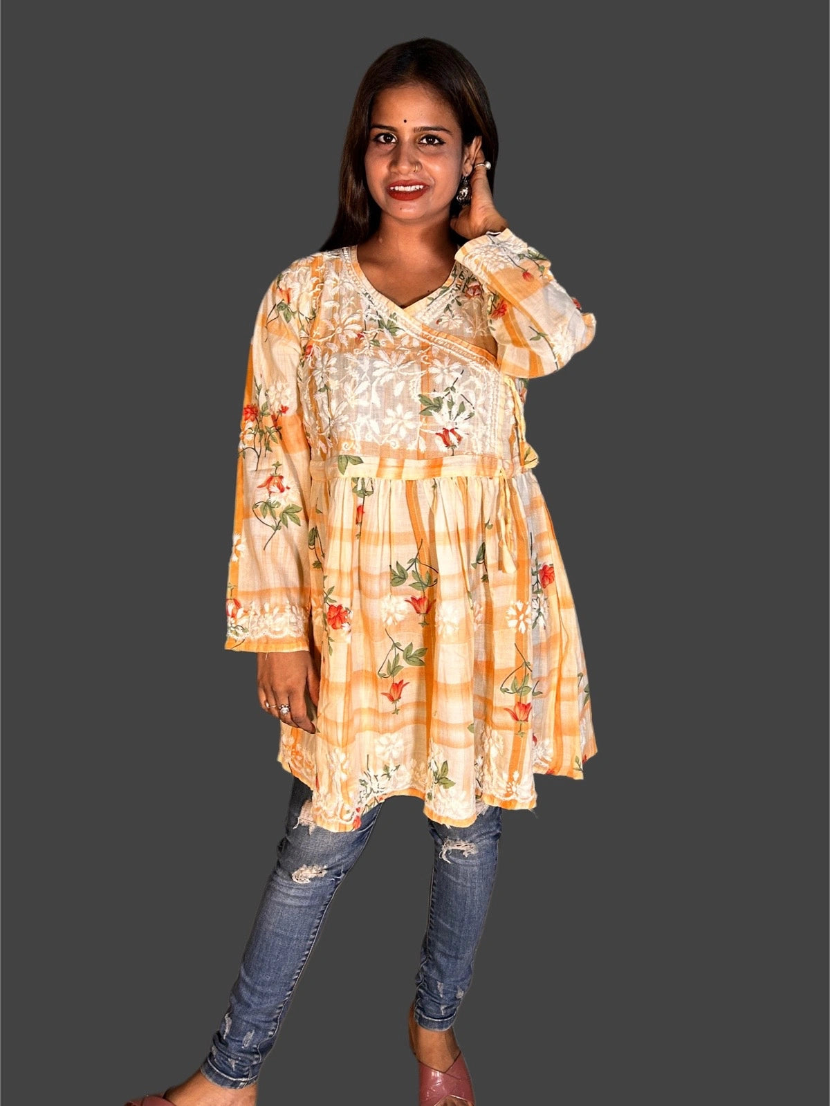 lucknowi chikankari Woman wearing a floral dress with a plain background
