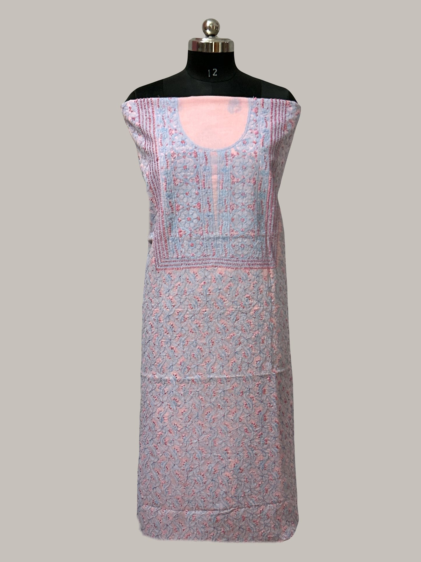 lucknowi chikankari Patterned dress on a mannequin against a plain background