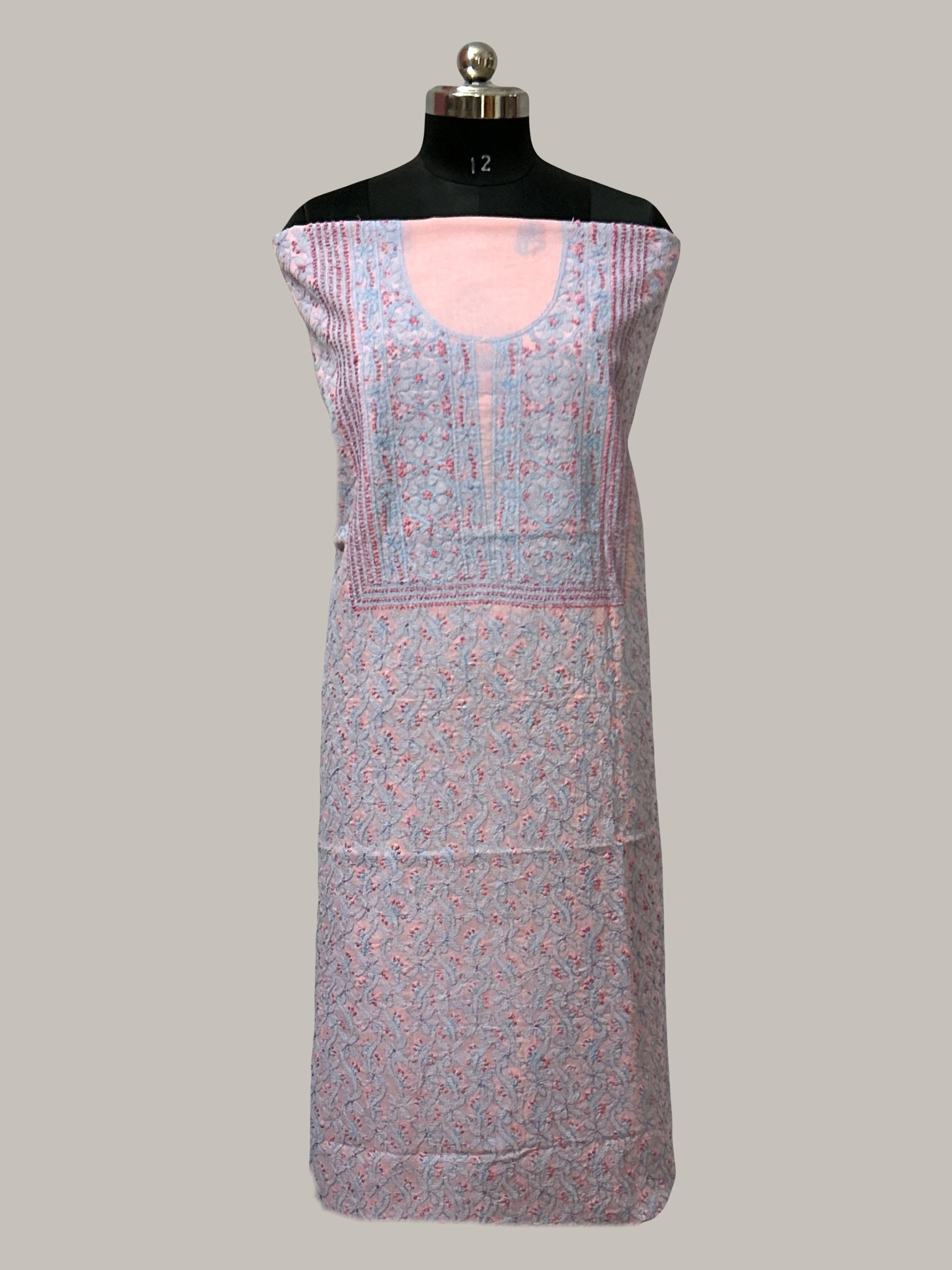 lucknowi chikankari Patterned dress on a mannequin against a plain background