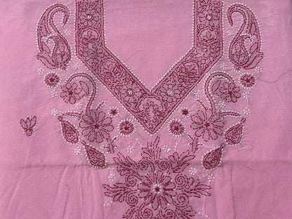 Pink fabric with intricate floral and paisley embroidery